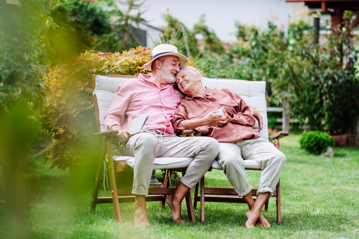 elderly-couple-sitting-in-the-garden